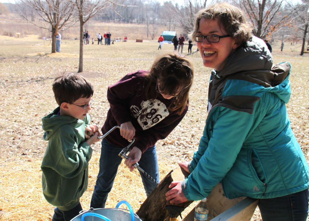 Nature center visitors try pioneer tools